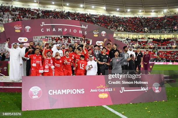 Al Arabi players celebrate after the 2023 Amir Cup final at Ahmad Bin Ali Stadium on May 12, 2023 in Doha, Qatar.