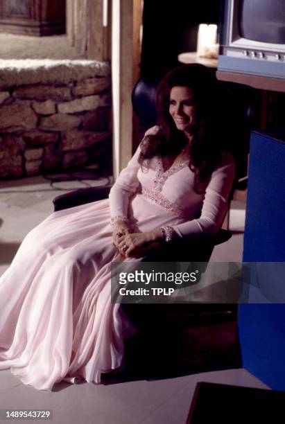 American singer, songwriter and dancer June Carter Cash sits backstage before an episode of The Johnny Cash Show in Tucson, Arizona, April 15, 1970.