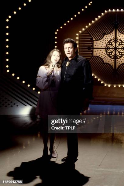 American singer-songwriter and musician Judy Collins and country singer Johnny Cash sing on stage during an episode of The Johnny Cash Show in...