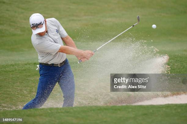 Charlie Wi of the United States plays a shot from the greenside bunker on the 18th hole during the second round of the Regions Tradition at Greystone...