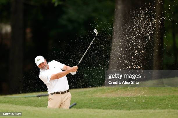 José María Olazábal of Spain plays a shot from the bunker on the first hole during the second round of the Regions Tradition at Greystone Golf and...