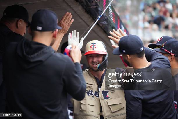 Minnesota Twins second baseman Kyle Farmer celebrates in the dugout after hitting a solo home run in the fourth inning against the San Diego Padres...