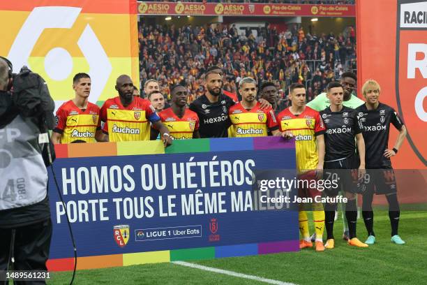 Players of Lens and Reims together behind a banner to promote gay rights before the Ligue 1 Uber Eats match between RC Lens and Stade de Reims at...