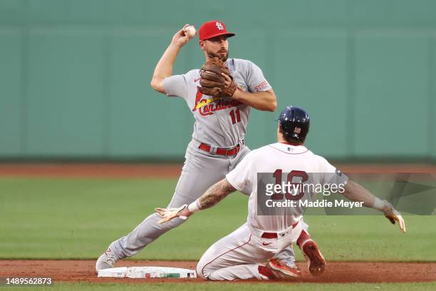 Paul DeJong of the St. Louis Cardinals turns a double play over Jarren Duran of the Boston Red Sox during the second inning at Fenway Park on May 12,...