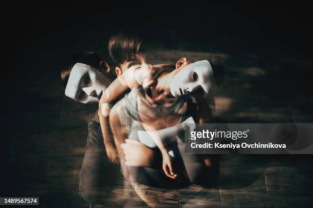 a masked boy is sitting on the floor, depressed - female internal organs stock pictures, royalty-free photos & images