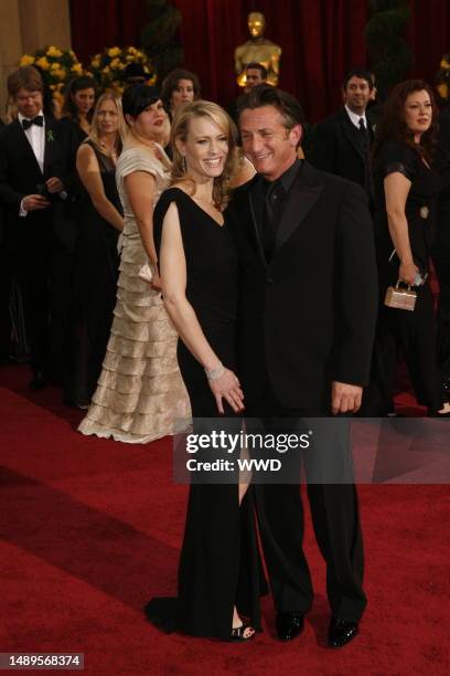 Robin Wright Penn and Sean Penn attend the 81st annual Academy Awards at the Kodak Theatre. Wright Penn wears Monique Lhuiller and Penn wears Giorgio...