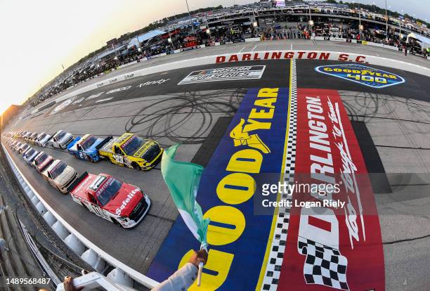 Corey Heim, driver of the Safelite Toyota, leads the field to the green flag to start the NASCAR Craftsman Truck Series Buckle Up South Carolina 200...