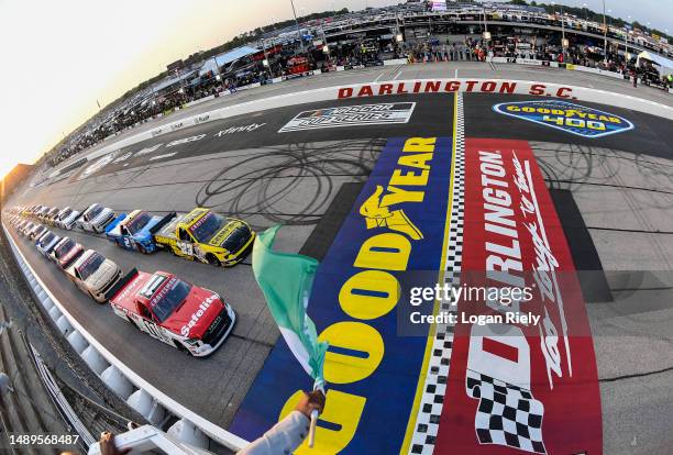 Corey Heim, driver of the Safelite Toyota, leads the field to the green flag to start the NASCAR Craftsman Truck Series Buckle Up South Carolina 200...