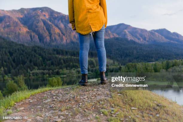 woman in nature with yellow jacket - columbia river gorge stock pictures, royalty-free photos & images