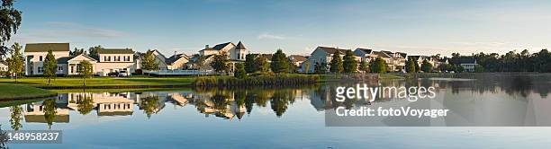 luxury lake shore homes reflected - orlando florida stock pictures, royalty-free photos & images