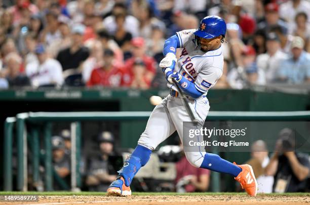 Francisco Lindor of the New York Mets drives in three runs with a single in the sixth inning against the Washington Nationals at Nationals Park on...