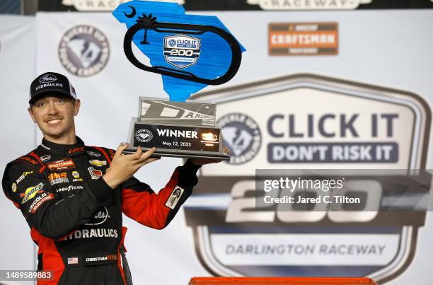 Christian Eckes, driver of the Gates Hydraulics Chevrolet, celebrates in victory lane after winning the NASCAR Craftsman Truck Series Buckle Up South...