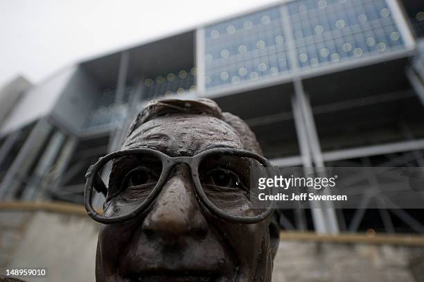 Rain falls on the statue of former Penn State University football coach Joe Paterno outside Beaver Stadium July 20, 2012 in State College,...