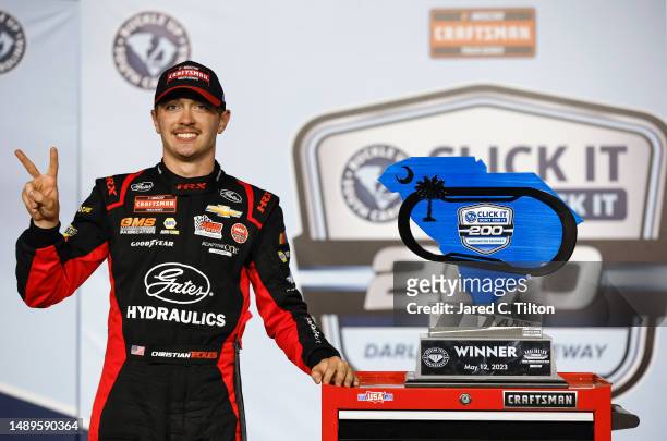 Christian Eckes, driver of the Gates Hydraulics Chevrolet, celebrates in victory lane after winning the NASCAR Craftsman Truck Series Buckle Up South...