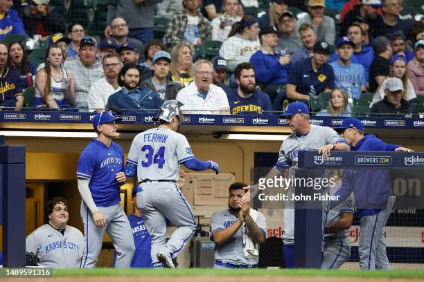Freddy Fermin of the Kansas City Royals is congratulated in the dugout after hitting a solo home run in the seventh inning against the Milwaukee...