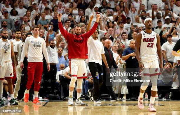 Jimmy Butler and Kevin Love of the Miami Heat celebrate winning game six of the Eastern Conference Semifinals in the 2023 NBA Playoffs against the...