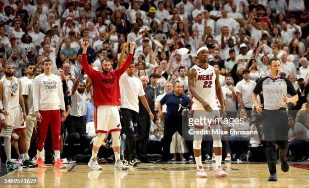 Jimmy Butler and Kevin Love of the Miami Heat celebrate winning game six of the Eastern Conference Semifinals in the 2023 NBA Playoffs against the...