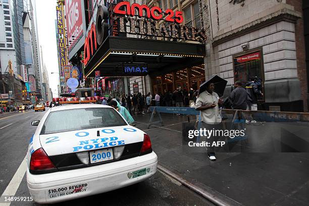 Heightened police presence at a movie theater in Times Square in New York on July 20, 2012 before a showing of "The Dark Knight Rises". Commissioner...