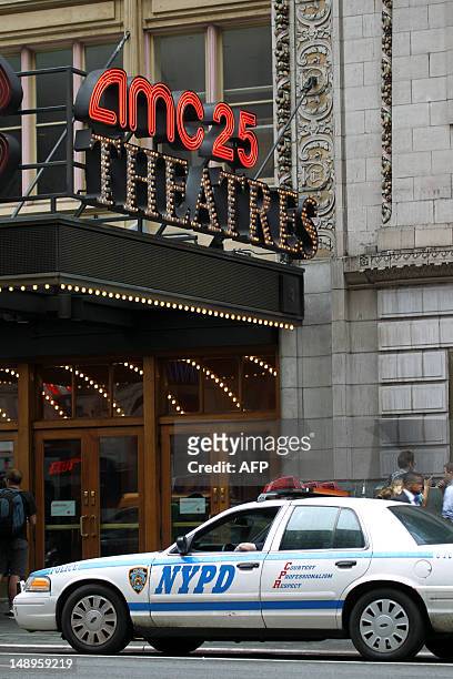 Heightened police presence at a movie theater in Times Square in New York on July 20, 2012 before a showing of "The Dark Knight Rises". Commissioner...