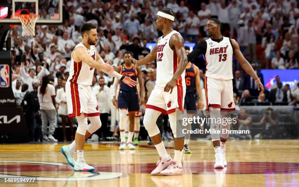 Jimmy Butler, Max Strus and Bam Adebayo of the Miami Heat shake hands during game six of the Eastern Conference Semifinals in the 2023 NBA Playoffs...