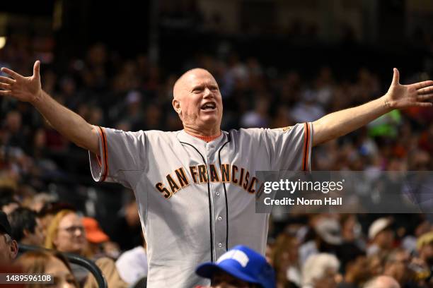 San Francisco Giants fan reacts after Joc Pederson hit a home run during the first inning of a game against the Arizona Diamondbacks at Chase Field...