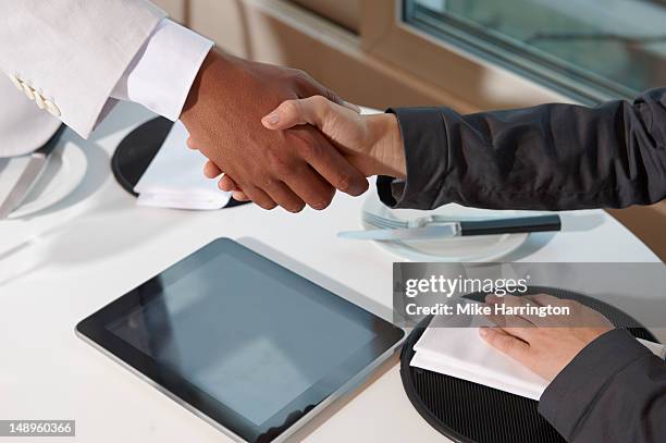 Hand Shaking Computer 94 Hands Shaking Over Table Stock Photos, High-Res Pictures, and Images ...
