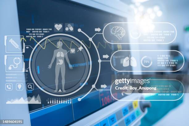 a vital signs monitor while using in operating room in hospital with futuristic technology icon. - medical procedure stock pictures, royalty-free photos & images