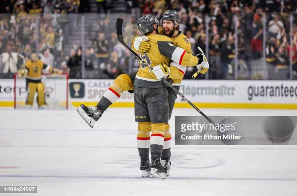 Nicolas Hague and Jack Eichel of the Vegas Golden Knights hug after Eichel assisted Hague on a second-period goal against the Edmonton Oilers in Game...