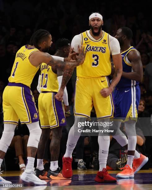 Anthony Davis of the Los Angeles Lakers reacts after his steal against the Golden State Warriors with D'Angelo Russell during the third quarter in...