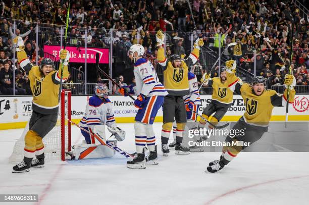 William Karlsson, Reilly Smith, Nicolas Roy and Ivan Barbashev of the Vegas Golden Knights react after Smith scored a second-period power-play goal...