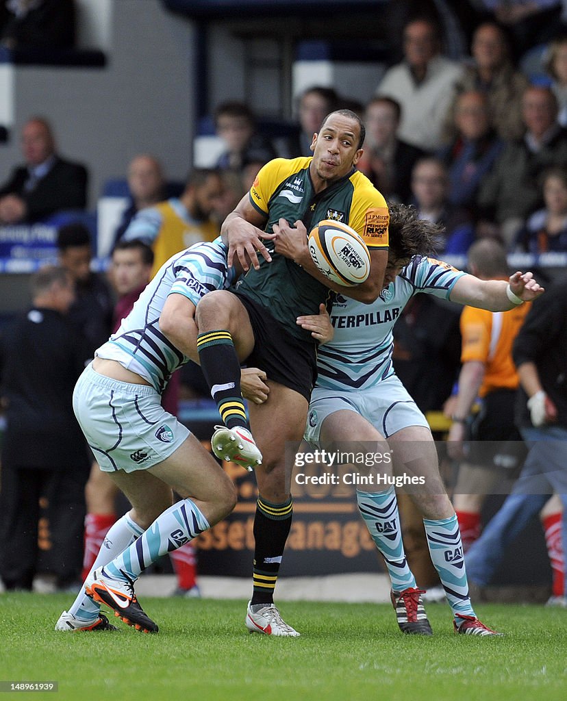 Darrell Roper Rugby Darrell Dyer of Northampton Saint is tackled during the JP Morgan ...