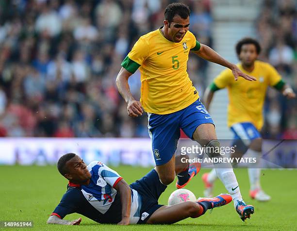 Great Britain defender Ryan Bertrand vies with Brazilian defender Sandro during their London 2012 Olympic games warm up football match between Great...