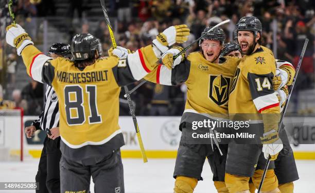 Jonathan Marchessault, Jack Eichel and Nicolas Hague of the Vegas Golden Knights react after Eichel and Marchessault assisted Hague on a...