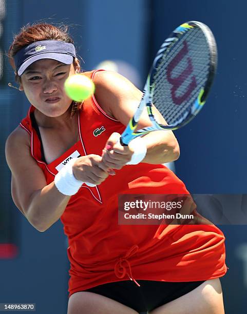 Yung-Jan Chan of Taipei hits a return to Jelena Jankovic of Serbia during day seven of the Mercury Insurance Open Presented By Tri-City Medical at La...