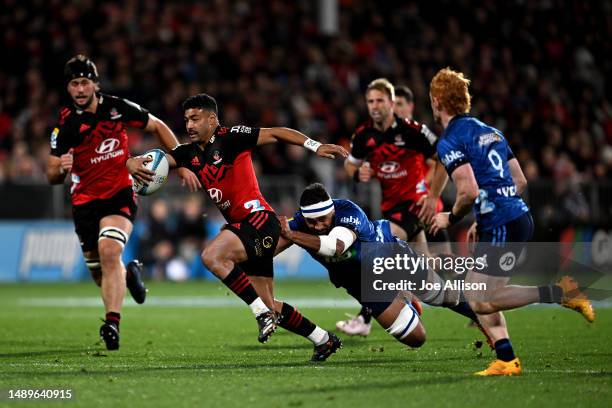 Richie Mo'unga of the Crusaders makes a break during the round 12 Super Rugby Pacific match between Crusaders and Blues at Orangetheory Stadium, on...