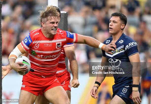Jack De Belin of the Dragons celebrates after scoring a try during the round 11 NRL match between North Queensland Cowboys and St George Illawarra...