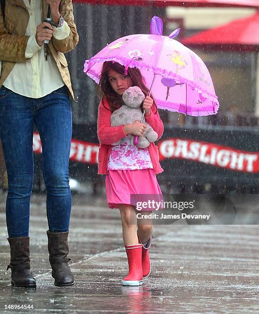 Suri Cruise seen walking in the rain in the Meat Packing District on July 20, 2012 in New York City.