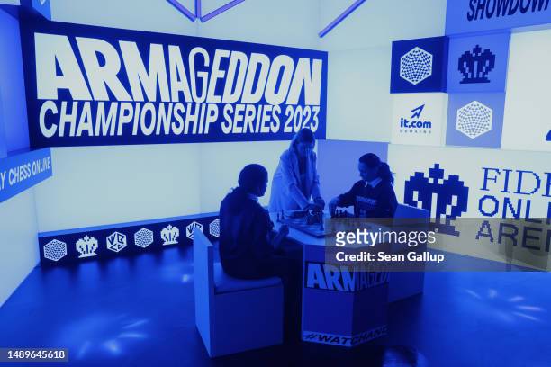 Chess grandmasters Alexandra Kosteniuk and Koneru Humpy prepare to face off during the women's week of the Armageddon Championship Series in a live...