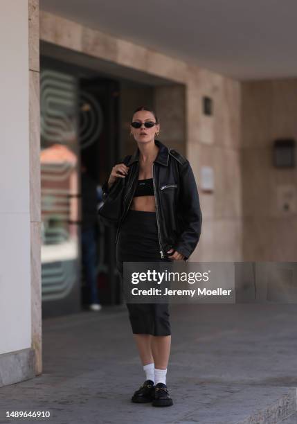 Alessa Winter seen wearing Gucci black leather loafer with golden details, white socks, Balenciaga black round shades, Gucci vintage black small...