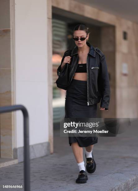 Alessa Winter seen wearing Gucci black leather loafer with golden details, white socks, Balenciaga black round shades, Gucci vintage black small...