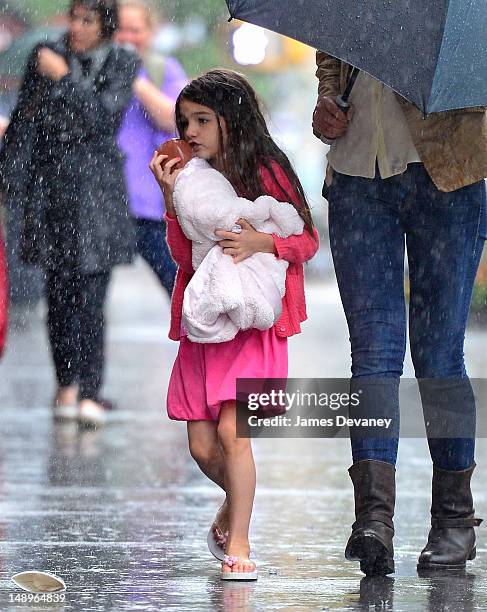 Suri Cruise seen walking in the rain in Chelsea on July 20, 2012 in New York City.