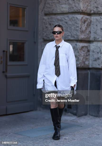 Alessa Winter seen wearing Nubikk black leather boots, YSL black leather golden logo bag, Fendi brown logo tie, Bottega Veneta black and silver...