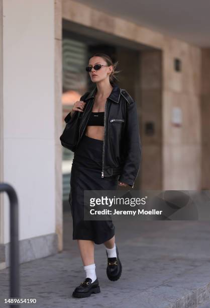 Alessa Winter seen wearing Gucci black leather loafer with golden details, white socks, Balenciaga black round shades, Gucci vintage black small...