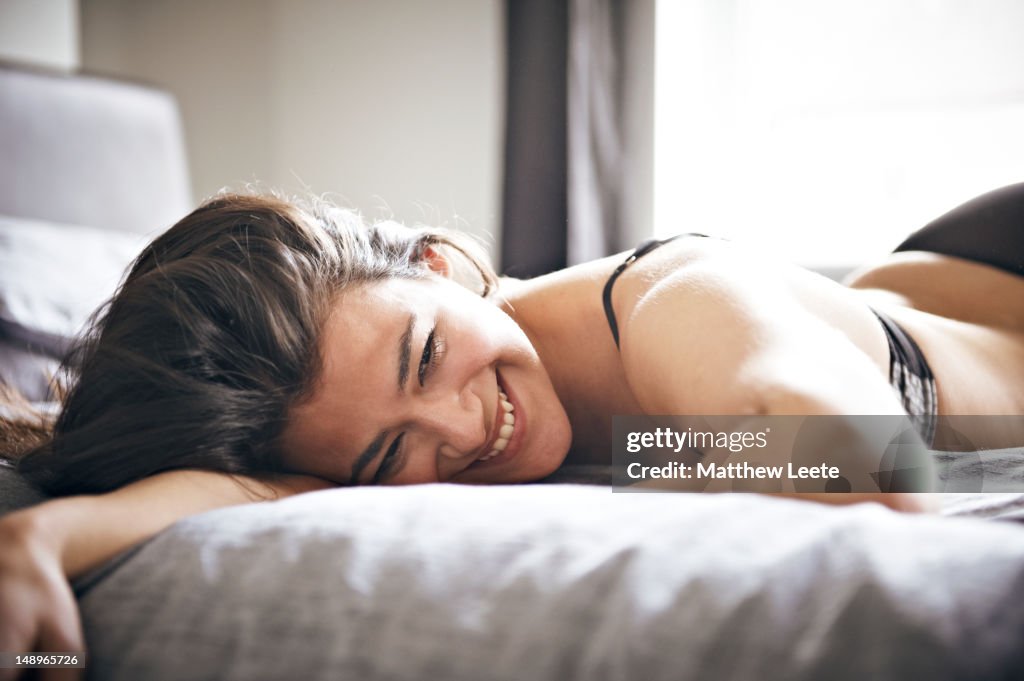 Caucasian female on bed