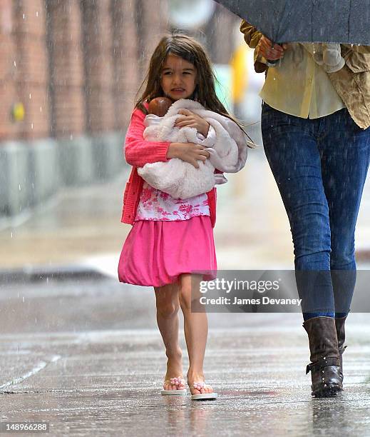 Suri Cruise seen walking in the rain in the Meat Packing District on July 20, 2012 in New York City.