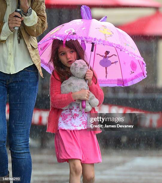 Suri Cruise seen walking in the rain in the Meat Packing District on July 20, 2012 in New York City.