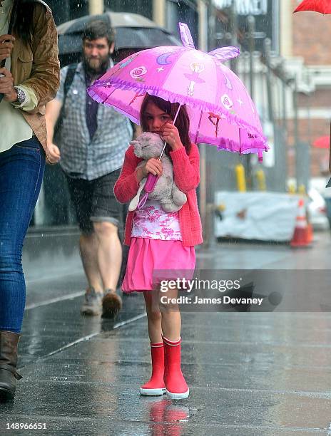 Suri Cruise seen walking in the rain in Chelsea on July 20, 2012 in New York City.