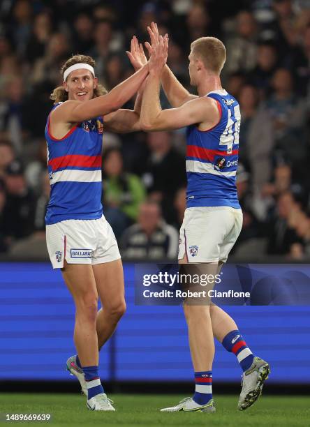 Aaron Naughton of the Bulldogs celebrates after scoring a goal during the round nine AFL match between Carlton Blues and Western Bulldogs at Marvel...