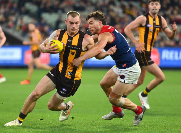 James Worpel of the Hawks is tackled by Jack Viney of the Demons during the round nine AFL match between Hawthorn Hawks and Melbourne Demons at...