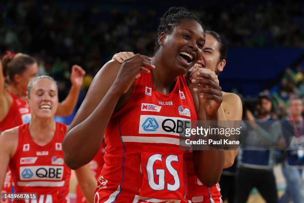 Romelda Aiken-George and Kelea Iongi of the Swifts celebrate winning the round nine Super Netball match between West Coast Fever and NSW Swifts at...